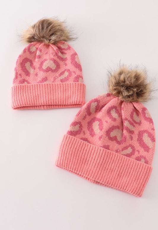 Pink pompom leopard cable beanie